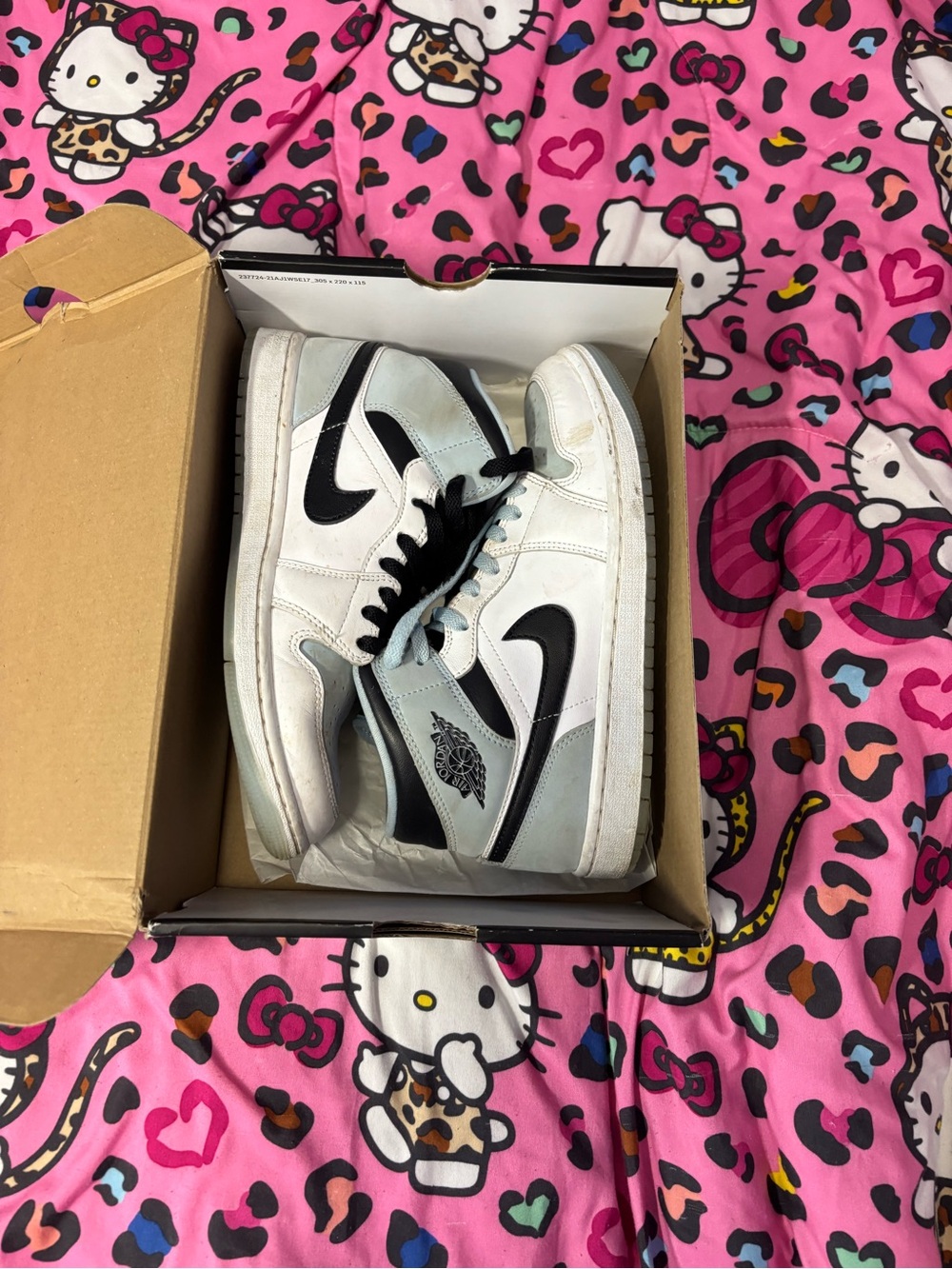 Nike women’s  Black and White High-Top Sneakers